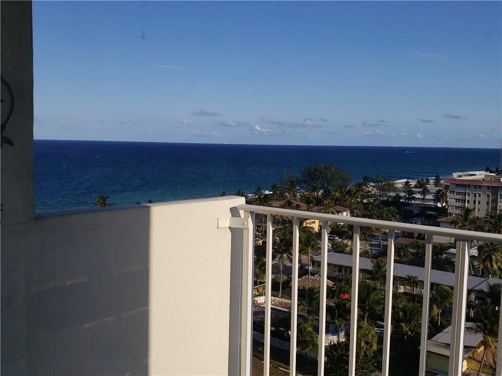 A high-angle view of the ocean and coastal landscape from a white balcony — 111 Briny Avenue # 1214, Pompano Beach FL 33062, POMPANO BEACH, FL