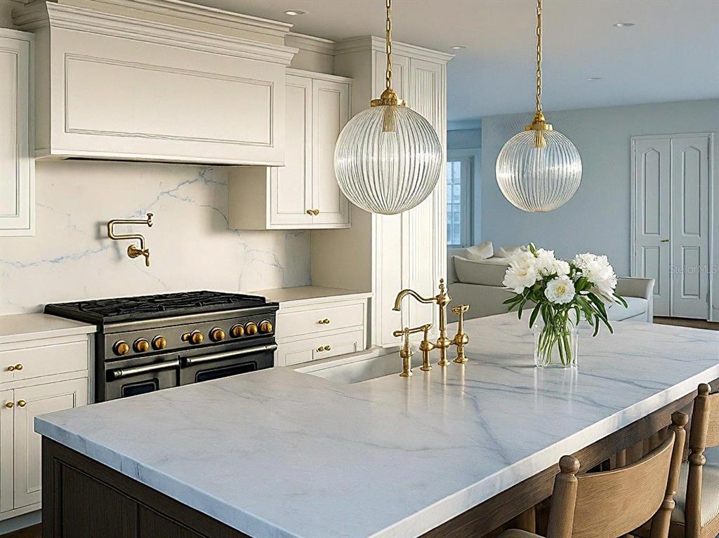 A kitchen features a marble island, white cabinetry, a black range, and two glass pendant lights — 149 W WILBUR AVENUE UNIT 105, LAKE MARY, FL
