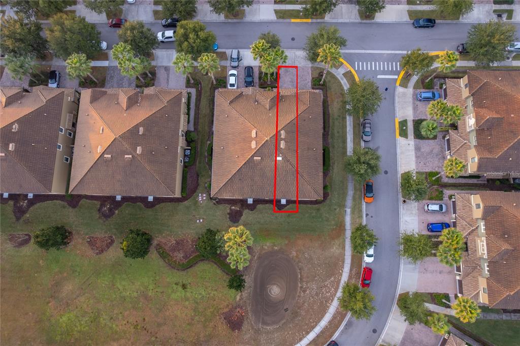An aerial view shows a residential building with a red rectangle highlighting a roof section — 8945 AZALEA SANDS LANE UNIT 8945, CHAMPIONS GATE, FL