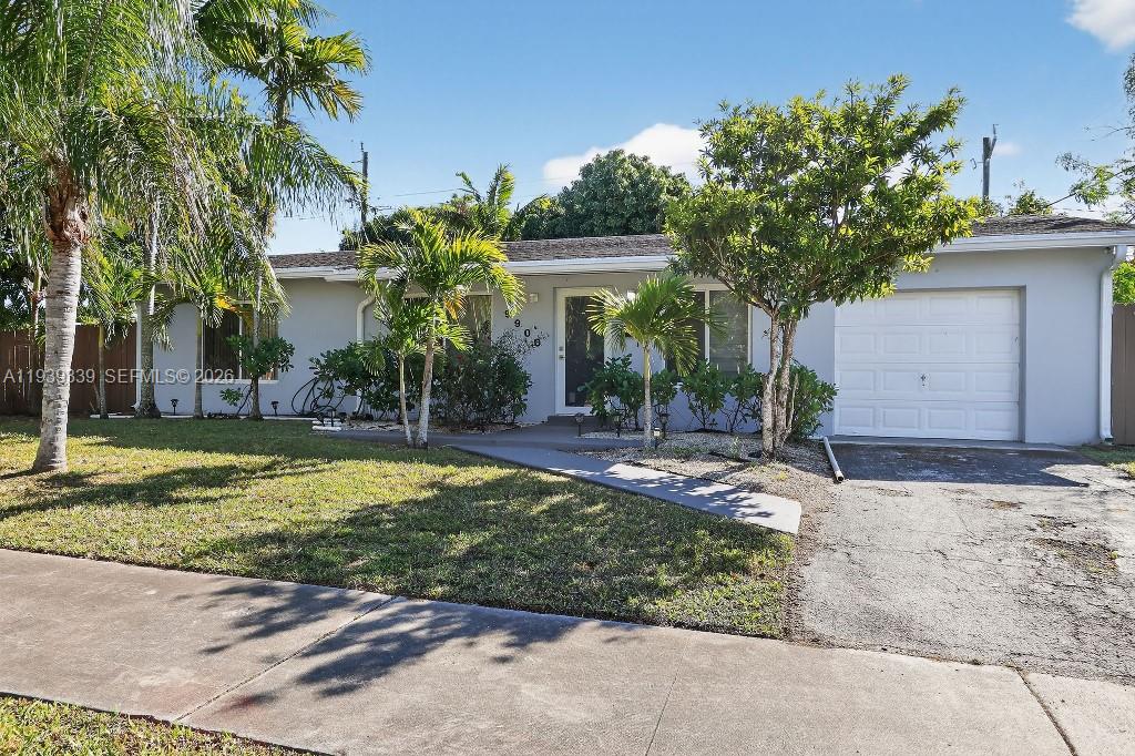 A single-story house with a gray exterior, a front lawn, and an attached garage — 9900 SW 164th Ter, Miami FL 33157, MIAMI, FL