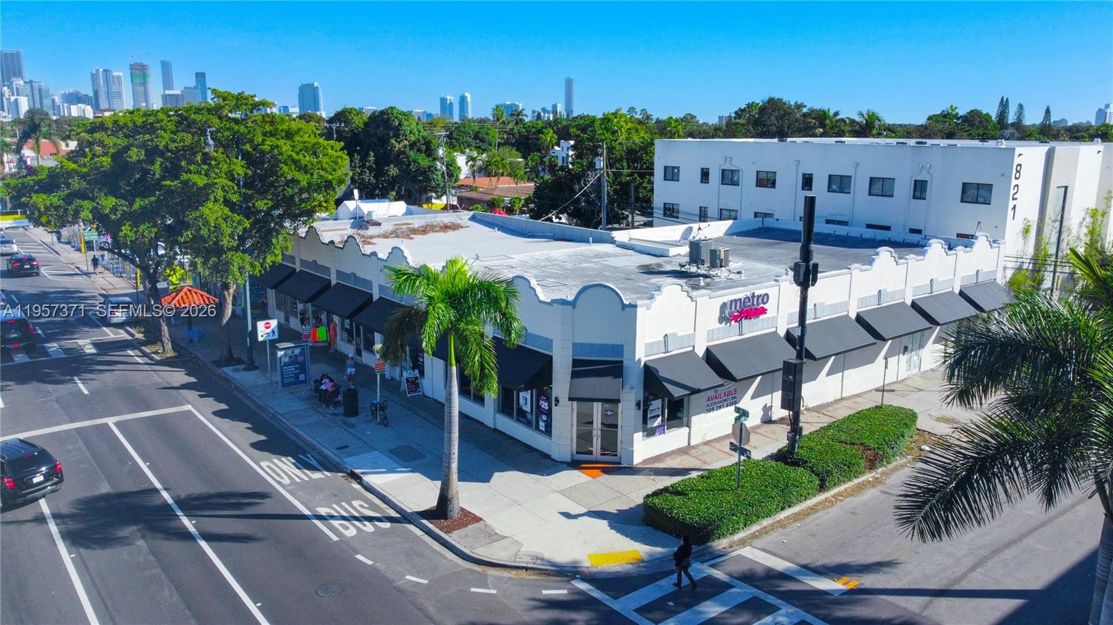 An aerial view shows a corner commercial building with black awnings and a flat roof — 1782 SW 8 st # 1792, Miami FL 33174, MIAMI, FL