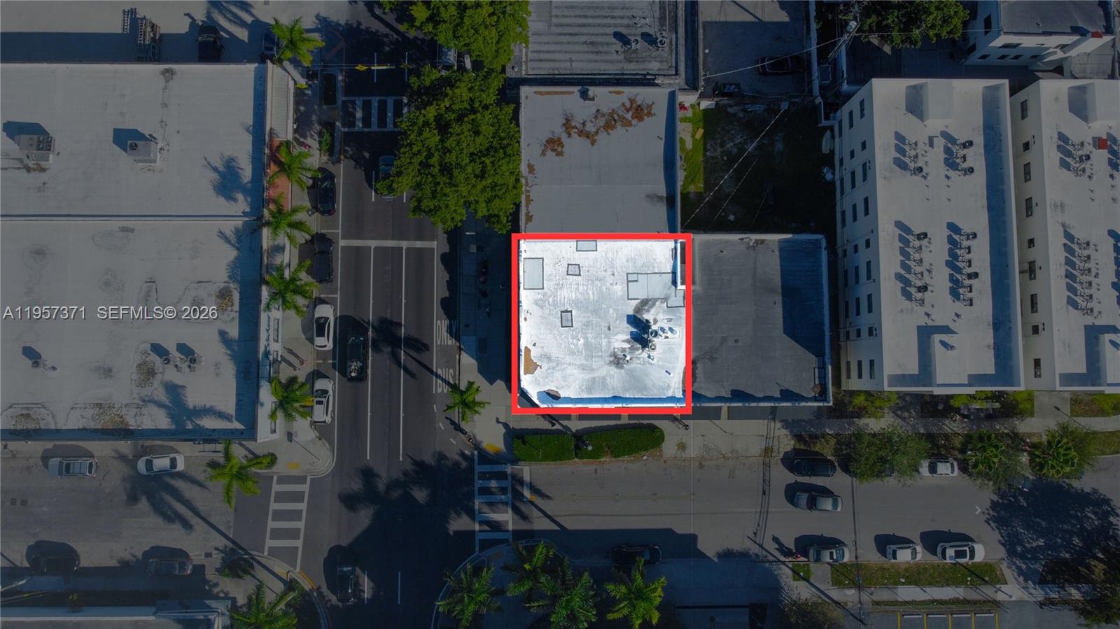 An aerial view shows a flat-roofed commercial building outlined in red within an urban setting — 1782 SW 8 st # 1792, Miami FL 33174, MIAMI, FL