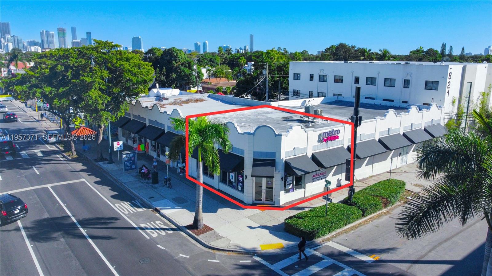An aerial view shows a corner commercial building with a white facade and black awnings — 1782 SW 8 st # 1792, Miami FL 33174, MIAMI, FL