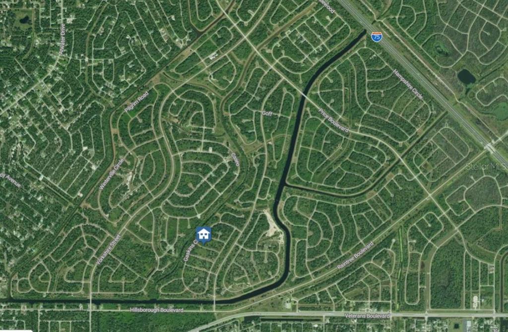 This is an aerial map showing a residential neighborhood with a house icon marking a property — Lot 13 SKINNER LANE, NORTH PORT, FL