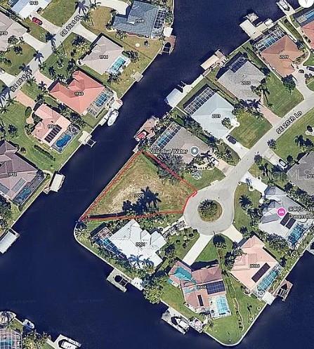 An aerial map view shows a vacant waterfront lot situated at the end of a cul-de-sac — 2005 SE 20TH LANE, CAPE CORAL, FL