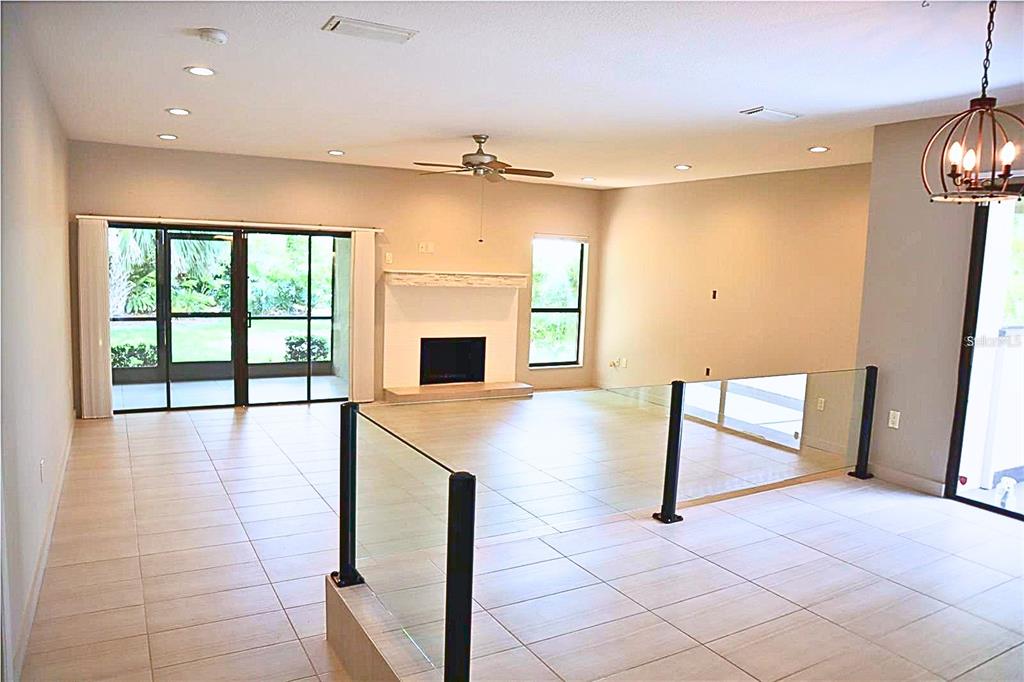 A paved walkway leads to the front entrance of a house with a red-tiled roof — 4820 KESTRAL PARK CIRCLE UNIT 18, SARASOTA, FL
