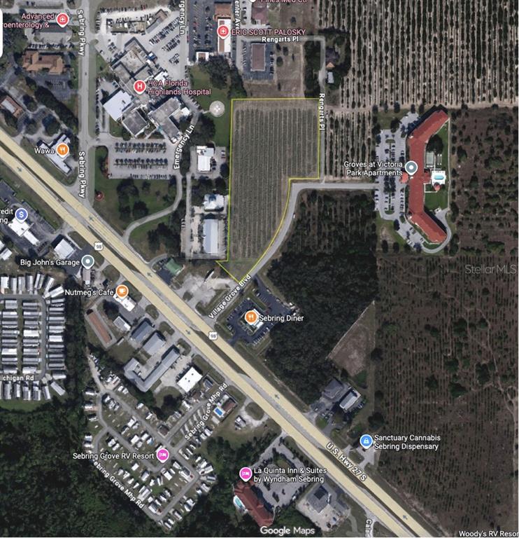 This is an aerial map showing a highlighted parcel of land near a hospital — 2000 VILLAGE GROVE BOULEVARD, SEBRING, FL