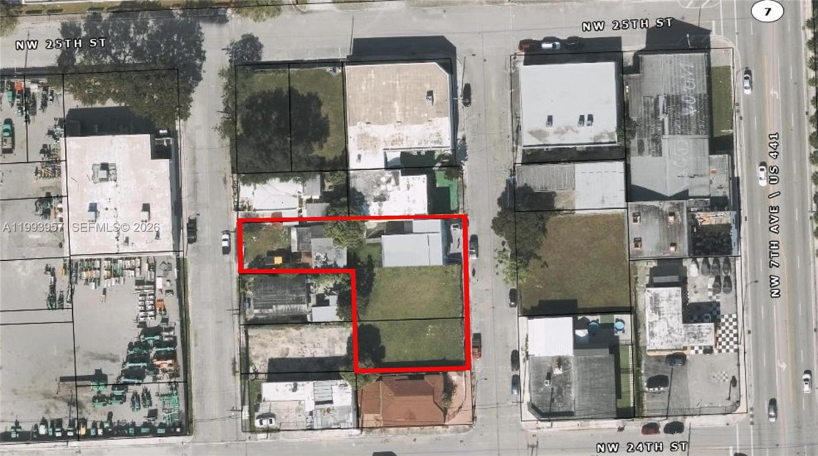 This is an aerial map showing a property outlined in red between city streets — 2410 NW 7th Ct, Miami FL 33127, MIAMI, FL