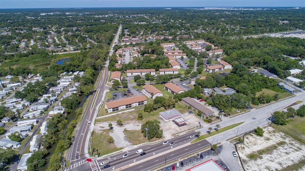 An aerial view shows a multi-family apartment complex situated between two busy roads — 2750 S RIDGEWOOD AVENUE, SOUTH DAYTONA, FL