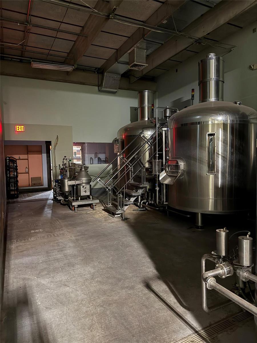 A brewery production area features large stainless steel fermentation tanks and industrial concrete flooring — 3410 29th Avenue, Hollywood FL 33020, HOLLYWOOD, FL