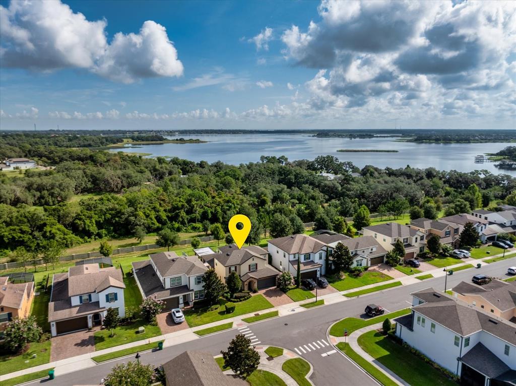 An aerial view shows a suburban neighborhood with a house marked by a yellow pin — 16971 TRADEWIND POINT, WINTER GARDEN, FL