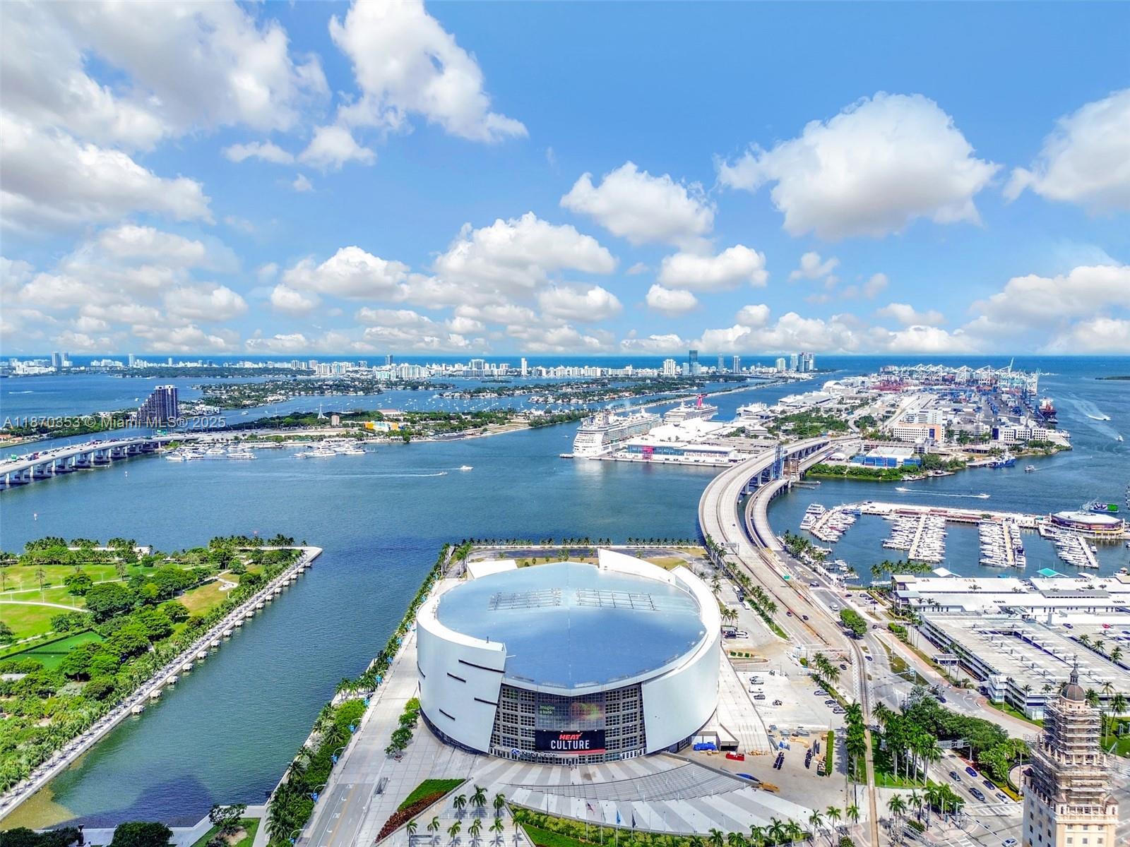 An aerial view shows the Kaseya Center in Miami with the surrounding bay and bridges — 159 NE 6th St # 4015, Miami FL 33132, MIAMI, FL