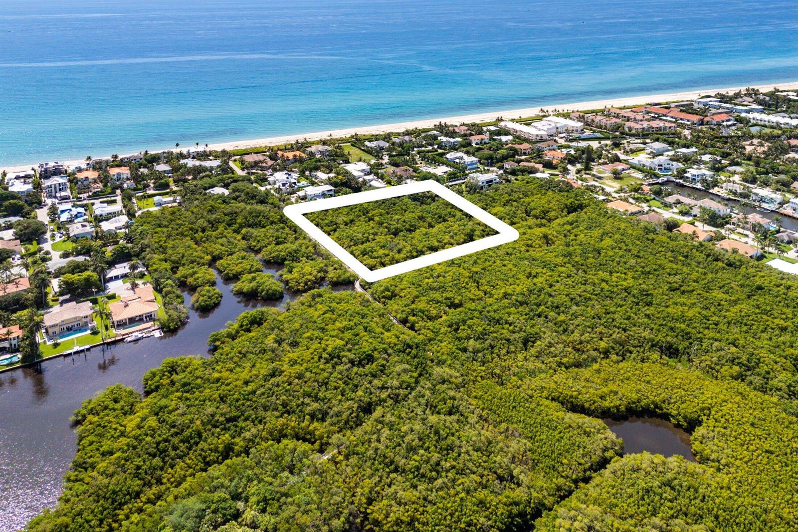 An aerial view shows a rectangular plot of land outlined in white amidst dense vegetation — 4 Whitney Way, Ocean Ridge FL 33435, OCEAN RIDGE, FL