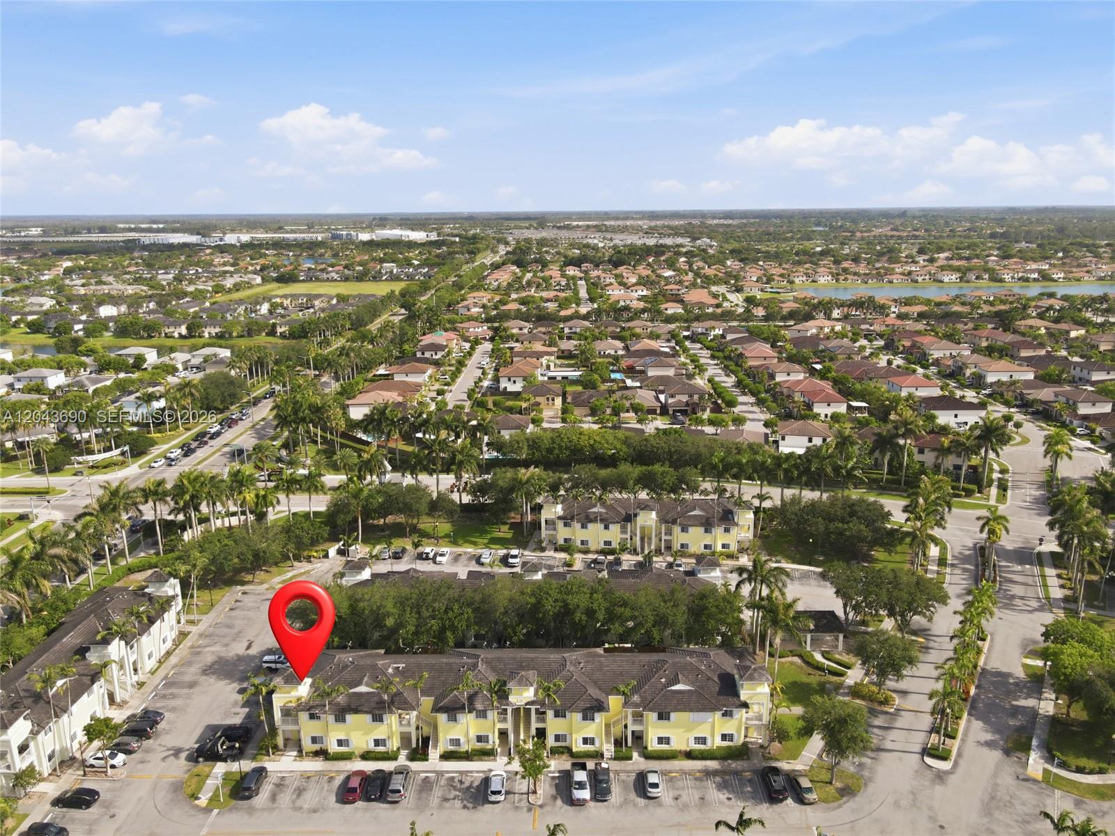 An aerial view shows a yellow multi-family residential building with a red location pin — 2728 NE 3rd Ct # 201, Homestead FL 33033, HOMESTEAD, FL