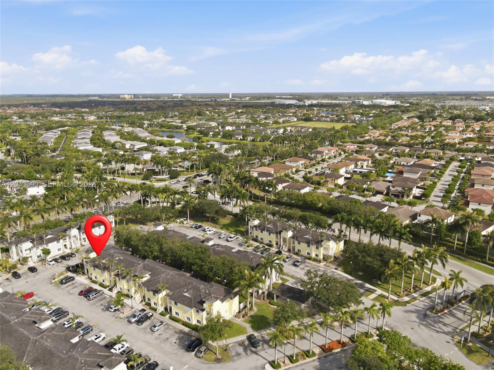 An aerial view shows a multi-unit residential complex with parking lots and palm trees — 2728 NE 3rd Ct # 201, Homestead FL 33033, HOMESTEAD, FL