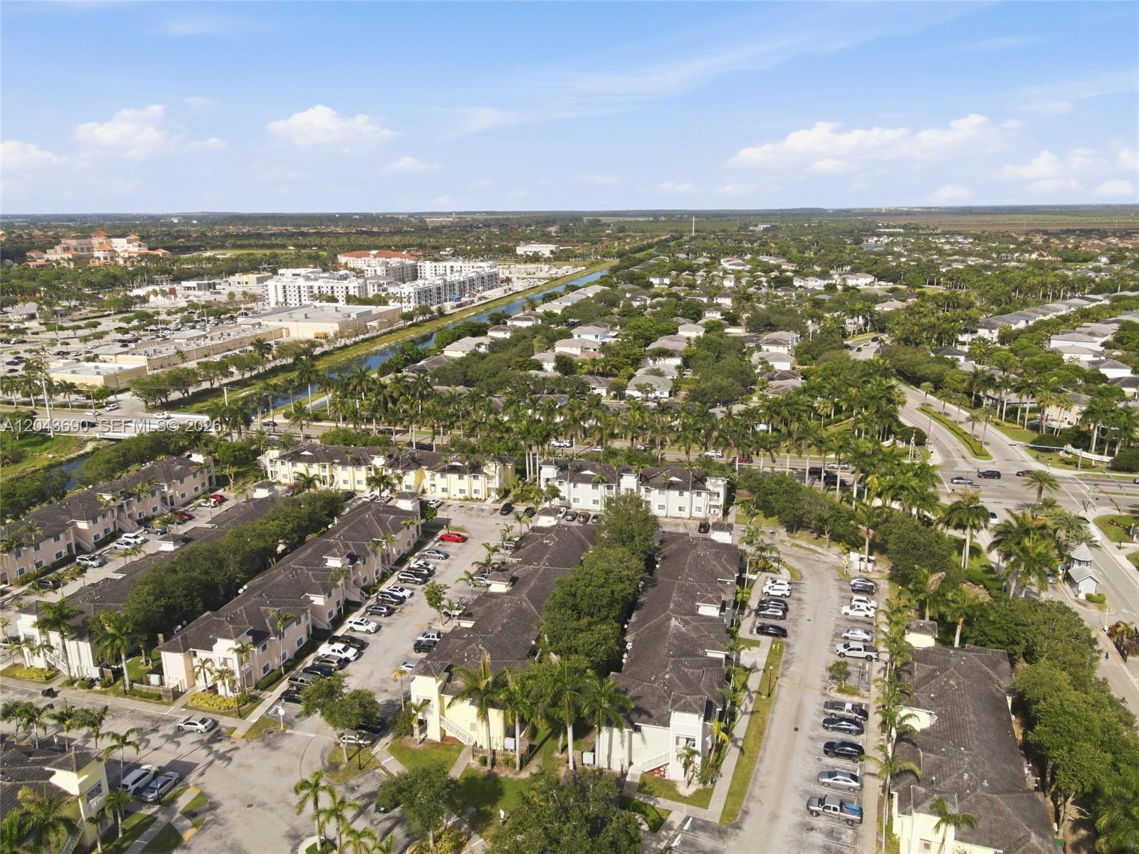 An aerial view shows a residential complex with multi-story buildings, parking lots, and palm trees — 2728 NE 3rd Ct # 201, Homestead FL 33033, HOMESTEAD, FL