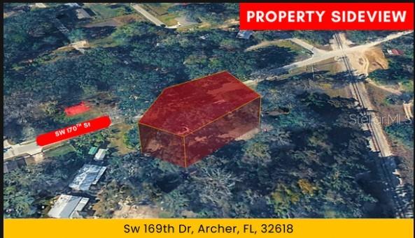 An aerial view shows a highlighted plot of land surrounded by trees and nearby roads — 500 N MAGNOLIA STREET, ARCHER, FL