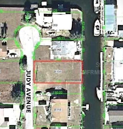 This is an aerial map showing a vacant residential lot outlined in red along a canal — Lot 33 JUDY AVENUE, HUDSON, FL