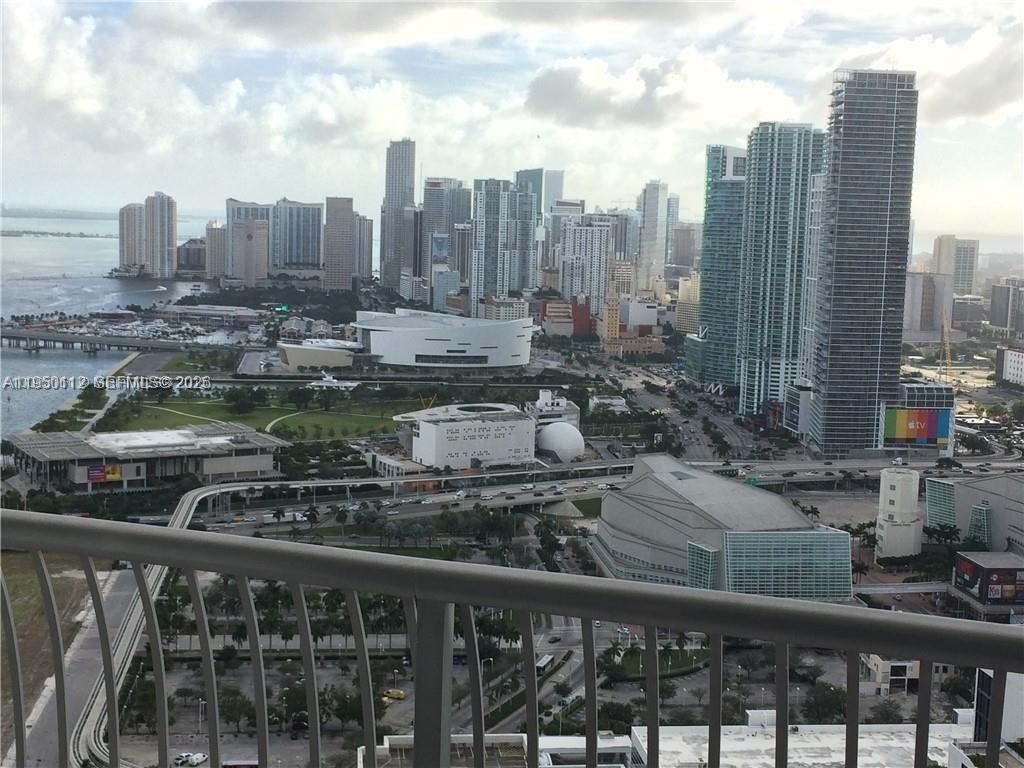 A high-angle view of the Miami skyline featuring skyscrapers, a park, and a stadium — 1750 N Bayshore Dr # 4912, Miami FL 33132, MIAMI, FL