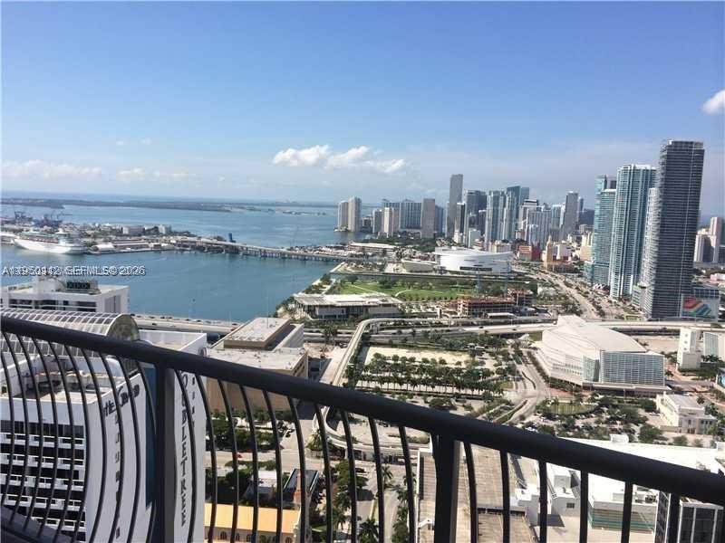 A high-angle view from a balcony overlooking the Miami skyline, bay, and port — 1750 N Bayshore Dr # 4912, Miami FL 33132, MIAMI, FL