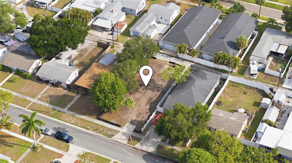 An aerial view shows a vacant residential lot situated between two existing houses — 845 50TH AVENUE N, ST PETERSBURG, FL