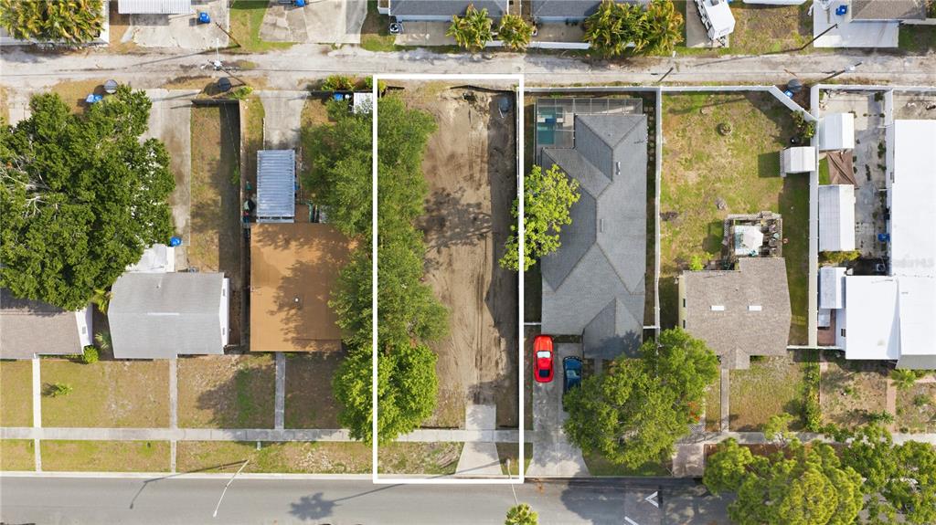 An aerial view shows a vacant, rectangular residential lot situated between two existing houses — 845 50TH AVENUE N, ST PETERSBURG, FL