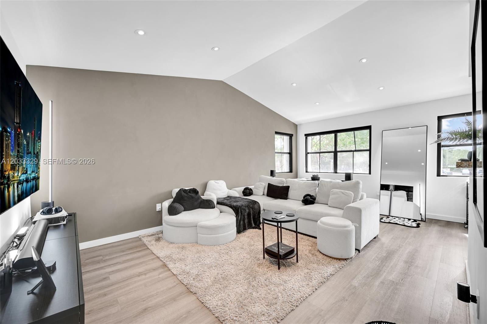 A swimming pool with lounge chairs and a gazebo sits in a landscaped outdoor area — 10560 SW 156th Pl # 208, Miami FL 33196, MIAMI, FL