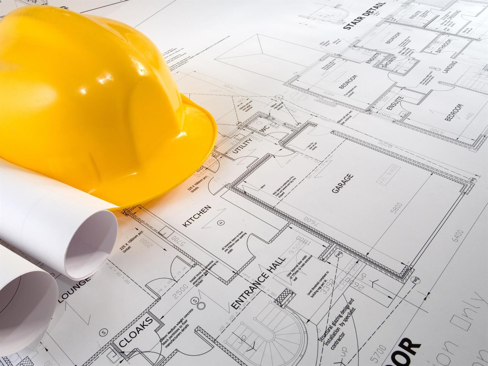 A yellow hard hat rests on top of a printed architectural floor plan — 1510 Briscoe Circle SW, Palm Bay FL 32908, PALM BAY, FL