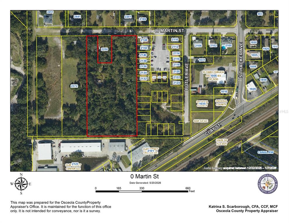 This is a property tax map showing land parcels and street layouts in Osceola County — W MARTIN STREET, KISSIMMEE, FL