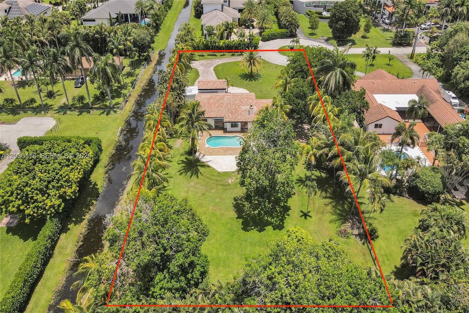 An aerial view shows a single-story house with a pool and large yard — 11460 SW 1st Ct, Plantation FL 33325, PLANTATION, FL