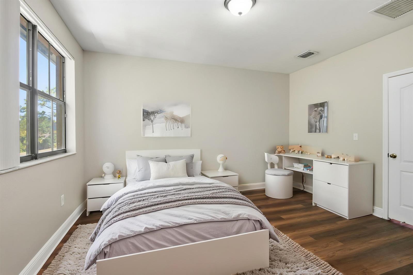 A bedroom features a bed, two nightstands, a desk with a chair, and wood flooring — 3720 SW 69th Avenue # 3720, Miami FL 33155, MIAMI, FL