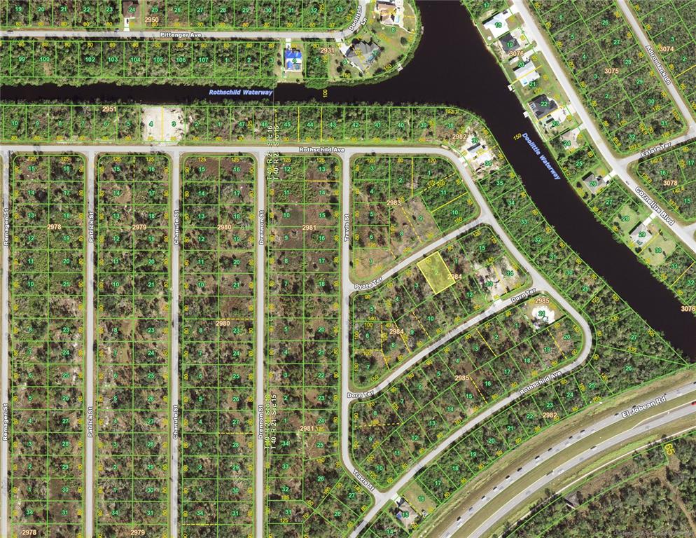 This is an aerial map showing a vacant lot highlighted in yellow within a residential area — 15061 PYOTE TERRACE, PORT CHARLOTTE, FL
