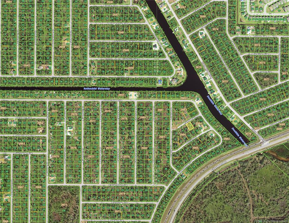 This is an aerial map showing a residential neighborhood with streets, lots, and waterways — 15061 PYOTE TERRACE, PORT CHARLOTTE, FL