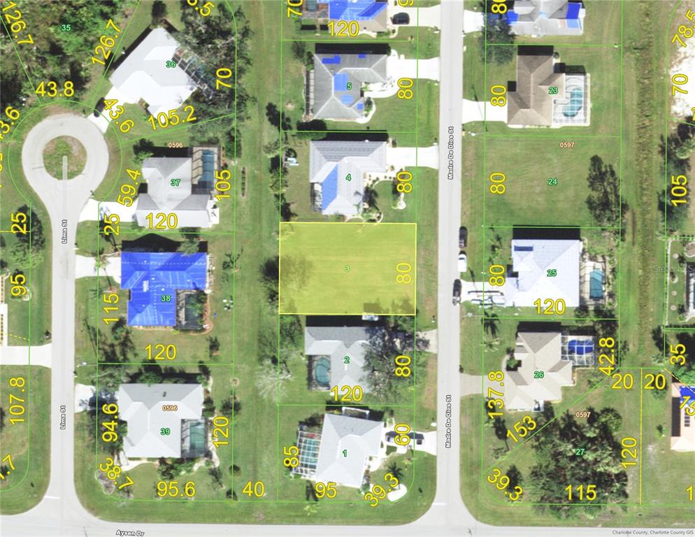 This is a property map showing a vacant residential lot highlighted in green — 107 MADRE DE DIOS STREET, PUNTA GORDA, FL