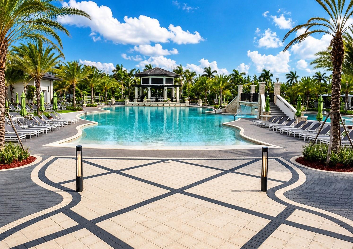 A large swimming pool with a gazebo and lounge chairs on a sunny day — 8820 NW 103rd Ave, Doral FL 33178, DORAL, FL