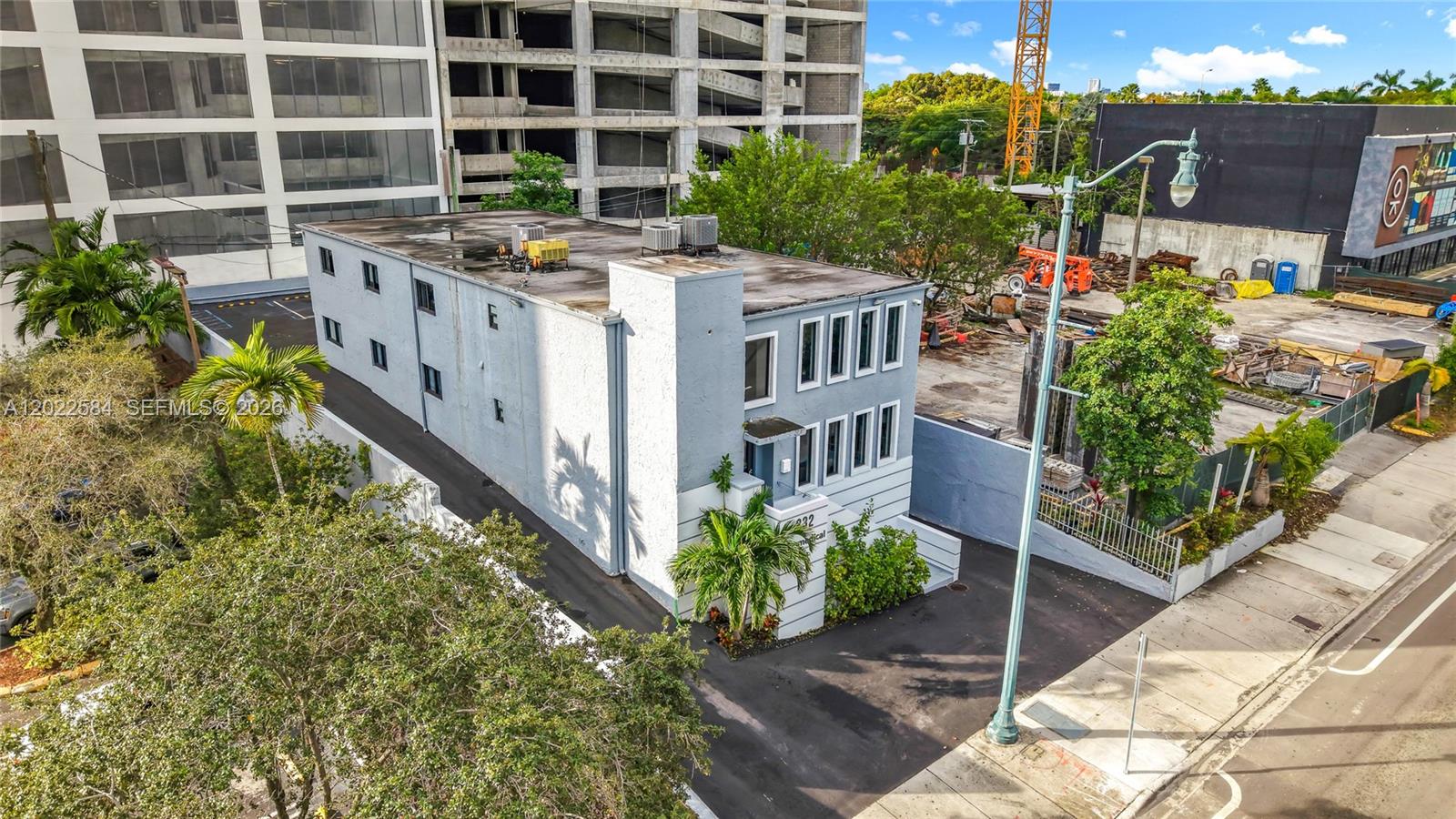 An aerial view shows a two-story gray building with a flat roof and parking area — 232 SW 8th St, Miami FL 33130, MIAMI, FL