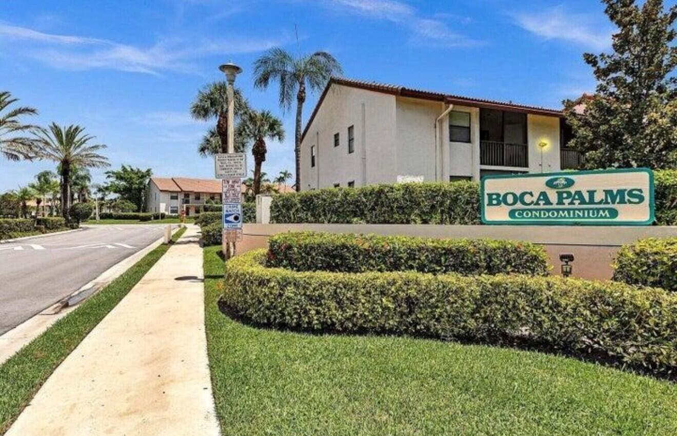 A sign for Boca Palms Condominium stands in front of a multi-story residential building — 22088 Palms Way # 204, Boca Raton FL 33433, BOCA RATON, FL