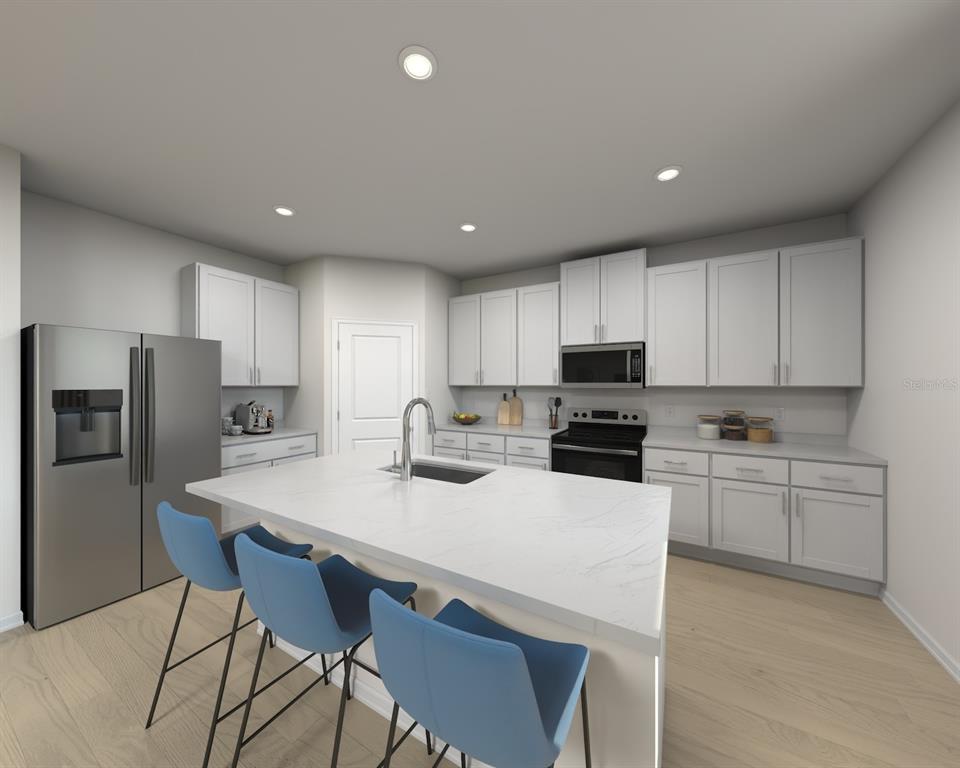 This is a rendering of a modern kitchen featuring white cabinetry, a central island, and stainless-steel appliances — 5194 GREEN BELT DRIVE, HAINES CITY, FL
