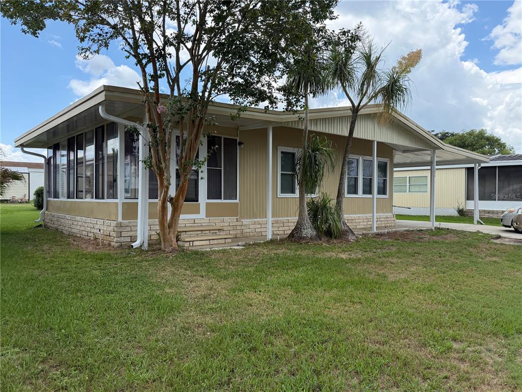 This is a floor plan of a single-story home with a screened porch and Florida room — 1676 ELKHART CIRCLE, TAVARES, FL