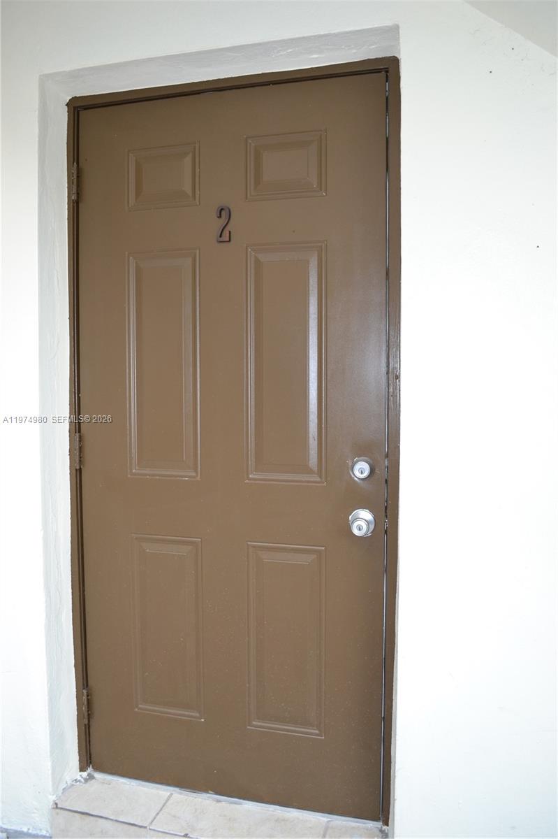 A brown exterior door with the number two is set into a white wall — 1035 SW 4th St # 2, Miami FL 33130, MIAMI, FL