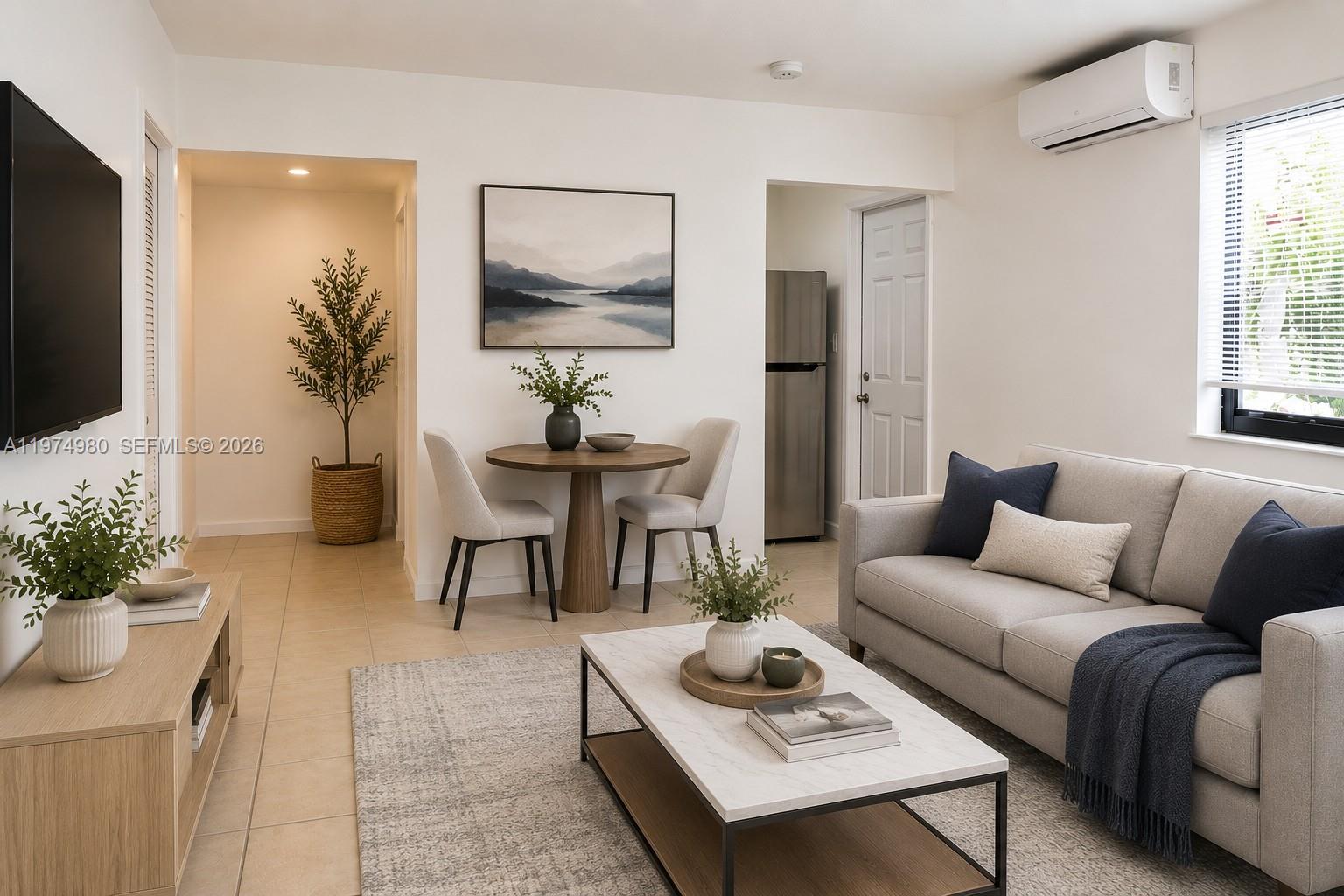 A living room features a sofa, coffee table, dining set, and tile flooring — 1035 SW 4th St # 2, Miami FL 33130, MIAMI, FL