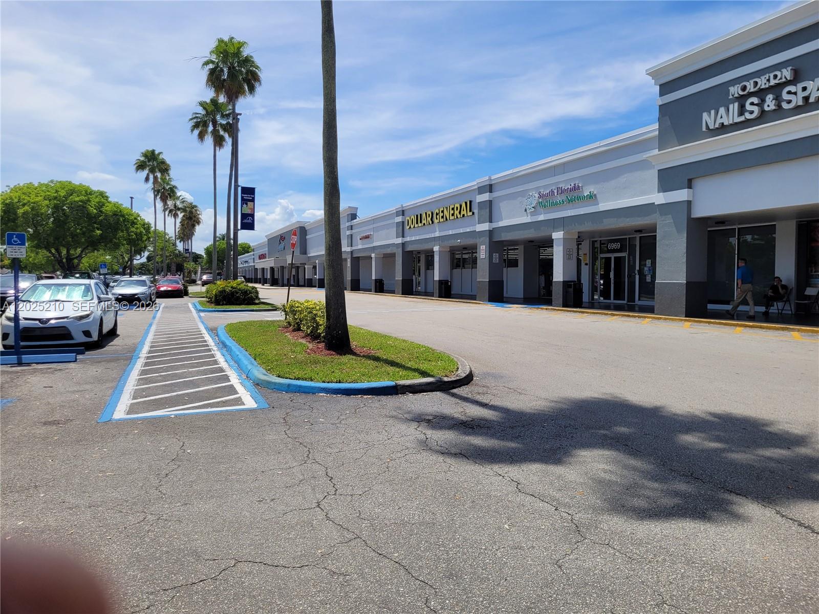 A strip mall exterior features a Dollar General, a wellness center, and a nail salon — 6935 Taft, Hollywood FL 33125, HOLLYWOOD, FL