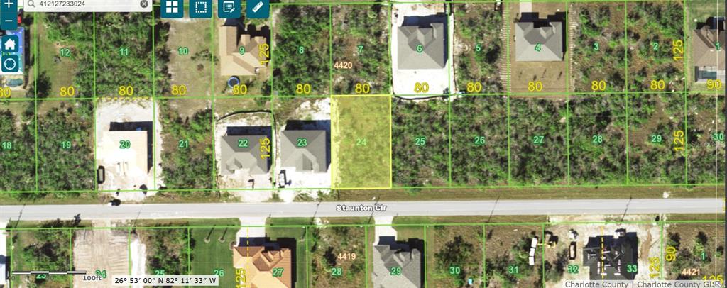 This is a satellite map view showing a vacant residential lot highlighted in yellow — 15755 STAUNTON CIRCLE, PORT CHARLOTTE, FL