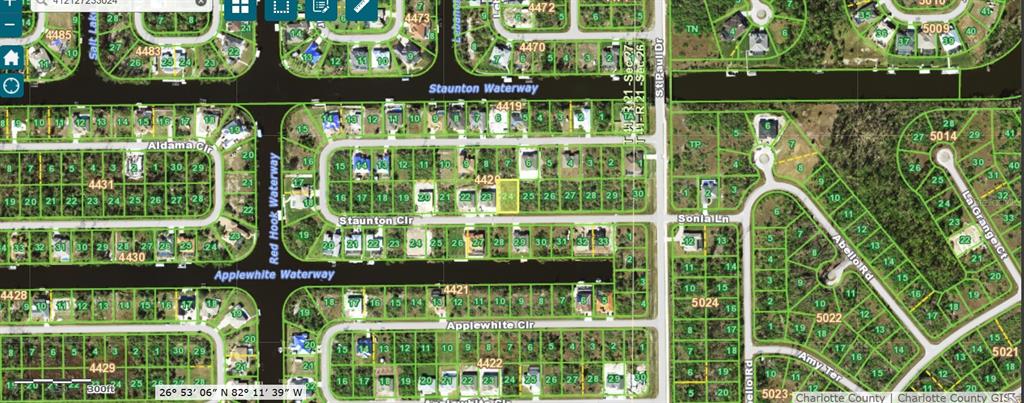 This is a satellite map showing residential lots and waterways in a suburban neighborhood — 15755 STAUNTON CIRCLE, PORT CHARLOTTE, FL