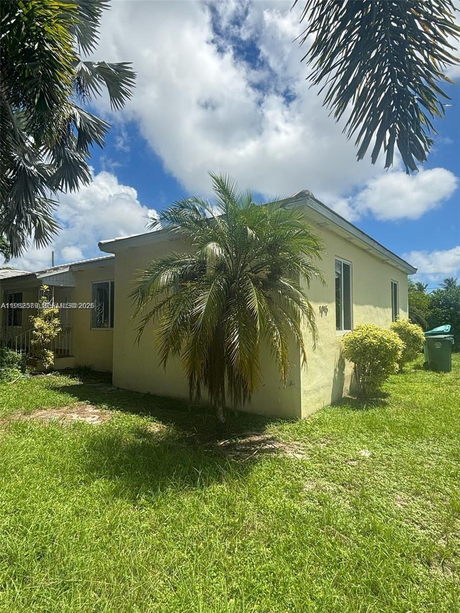 A light yellow single-story house features a palm tree in the front yard — 1015 NE 112th St, Biscayne Park FL 33161, BISCAYNE PARK, FL