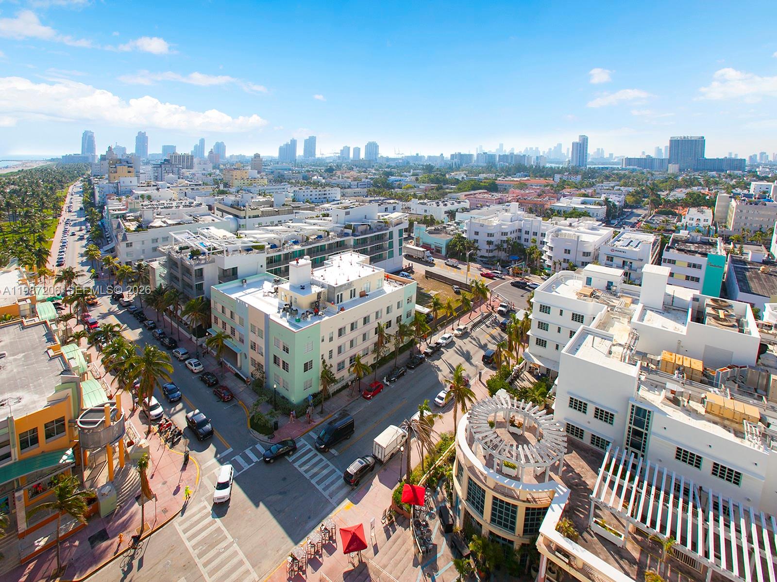 An aerial view of a city street intersection lined with palm trees and low-rise buildings — 1500 Ocean Dr # 10, Miami Beach FL 33139, MIAMI BEACH, FL