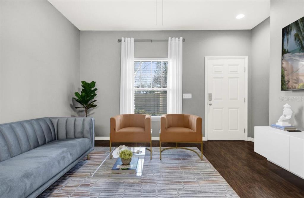 A living room features a grey sofa, two tan armchairs, a glass coffee table, and white curtains — 3202 GUANA WAY, KISSIMMEE, FL
