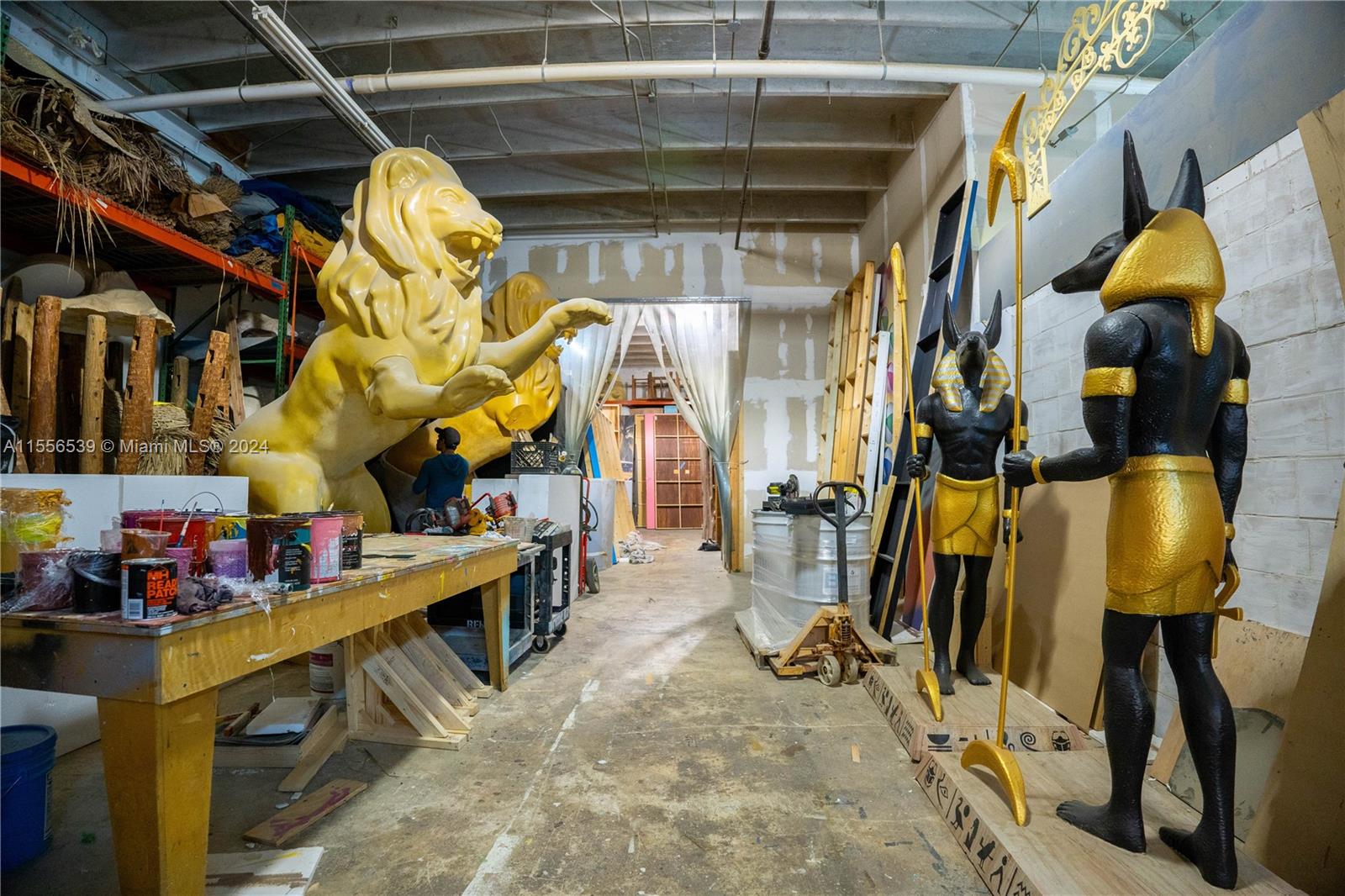 A workshop space contains large sculptures of a lion and two Egyptian figures — 1240 NW 74th St, Miami FL 33147, MIAMI, FL