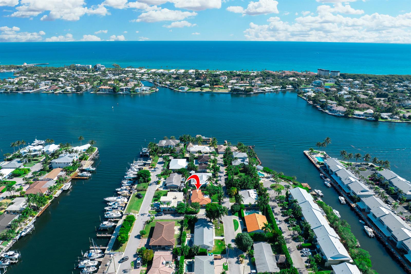 A single-story house with a tiled roof, concrete driveway, and manicured hedges under a blue sky — 815 South Road, Boynton Beach FL 33435, BOYNTON BEACH, FL