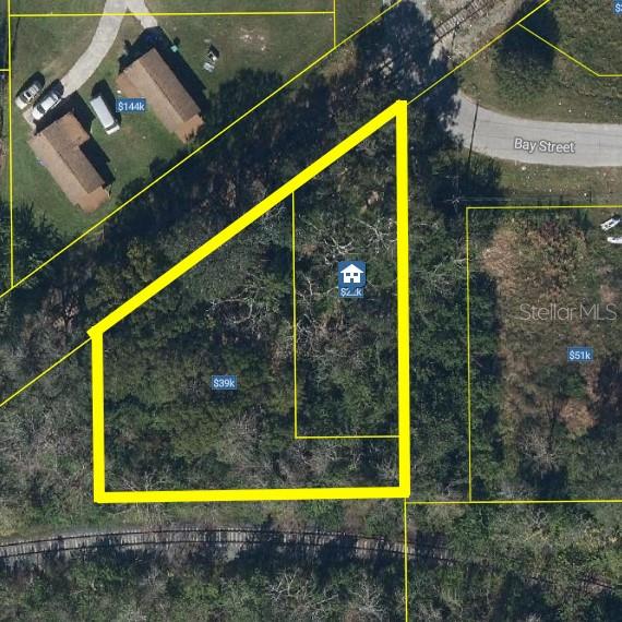 This is an aerial map view of a wooded residential lot outlined in yellow — 680 DUNBAR AVENUE, WINTER GARDEN, FL